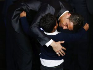 Portugal's Cristiano Ronaldo embraces his son Cristiano Ronaldo Jr after being awarded the FIFA Ballon d'Or 2013 in Zurich